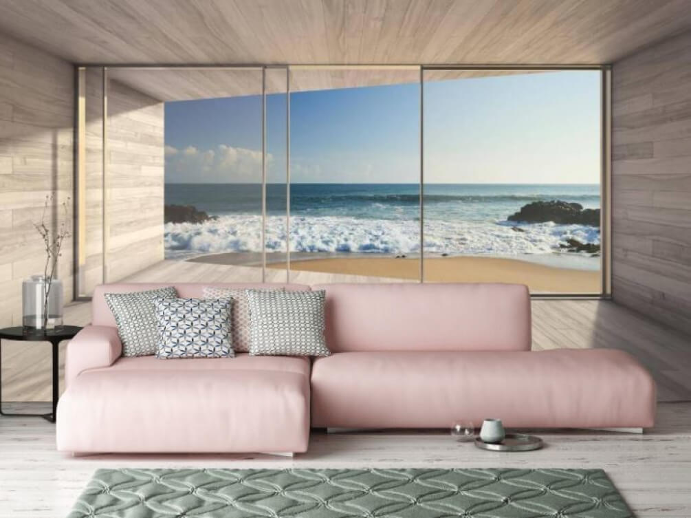 Room with large glass doors and a beach view