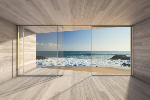 Room with large glass doors and a beach view