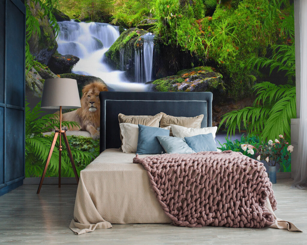 Lion lying on a rock next to a waterfall Lion lying on a rock next to a waterfall