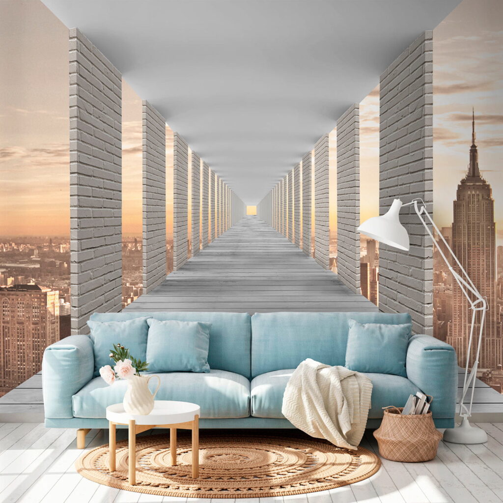 Long walkway with pillars and a city in the background
