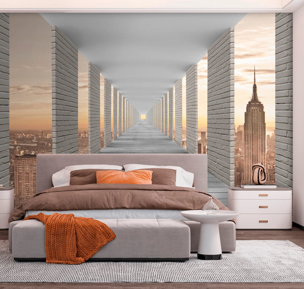 Long walkway with pillars and a city in the background