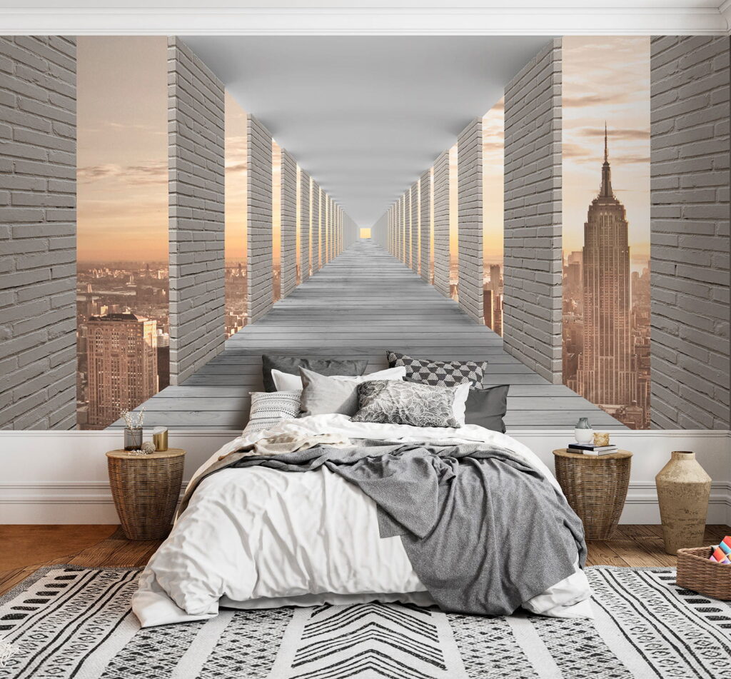 Long walkway with pillars and a city in the background