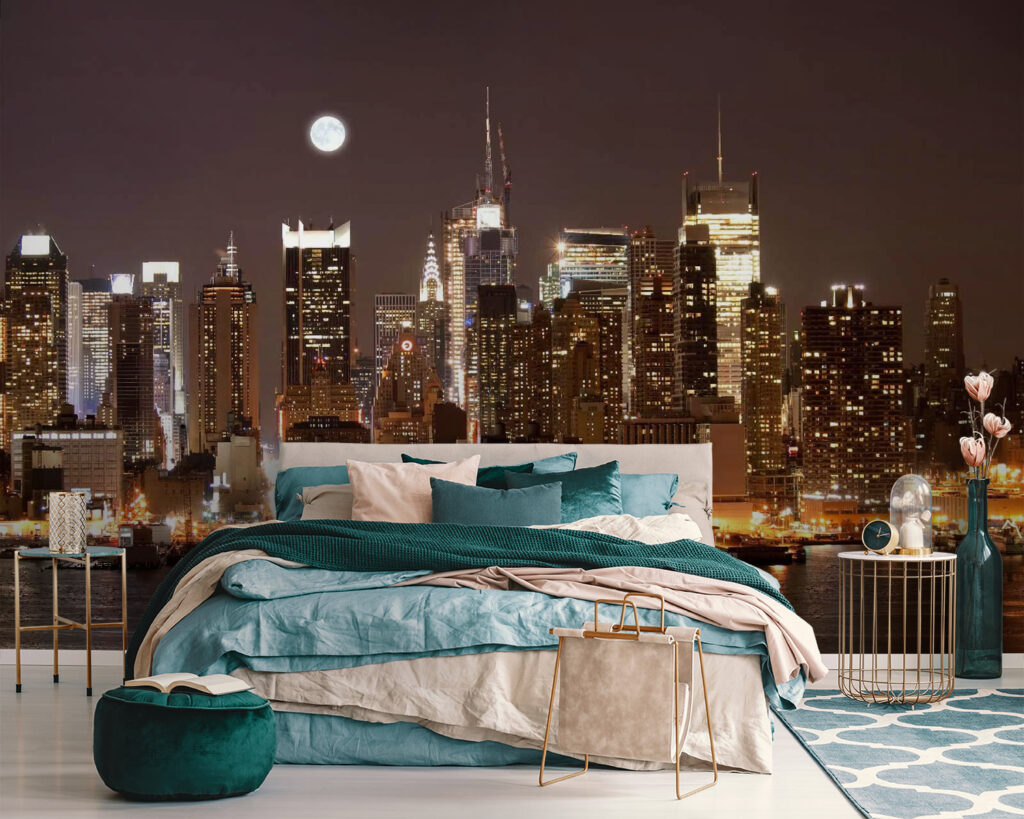 City skyline at night with the moon in the sky