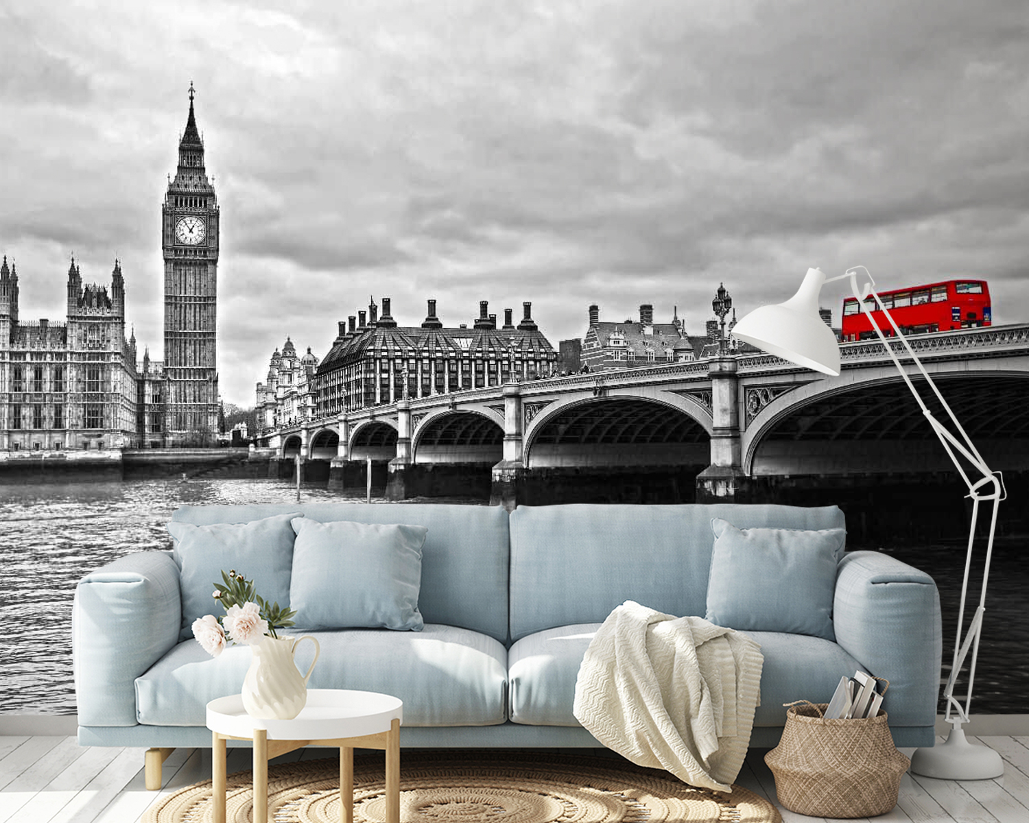 Bridge over water with a clock tower and a red bus