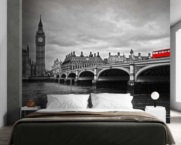 Bridge over water with a clock tower and a red bus