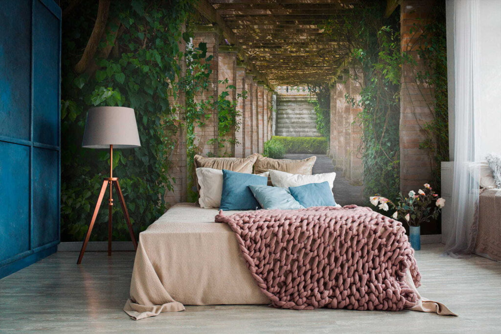 Walkway with stone pillars and vines