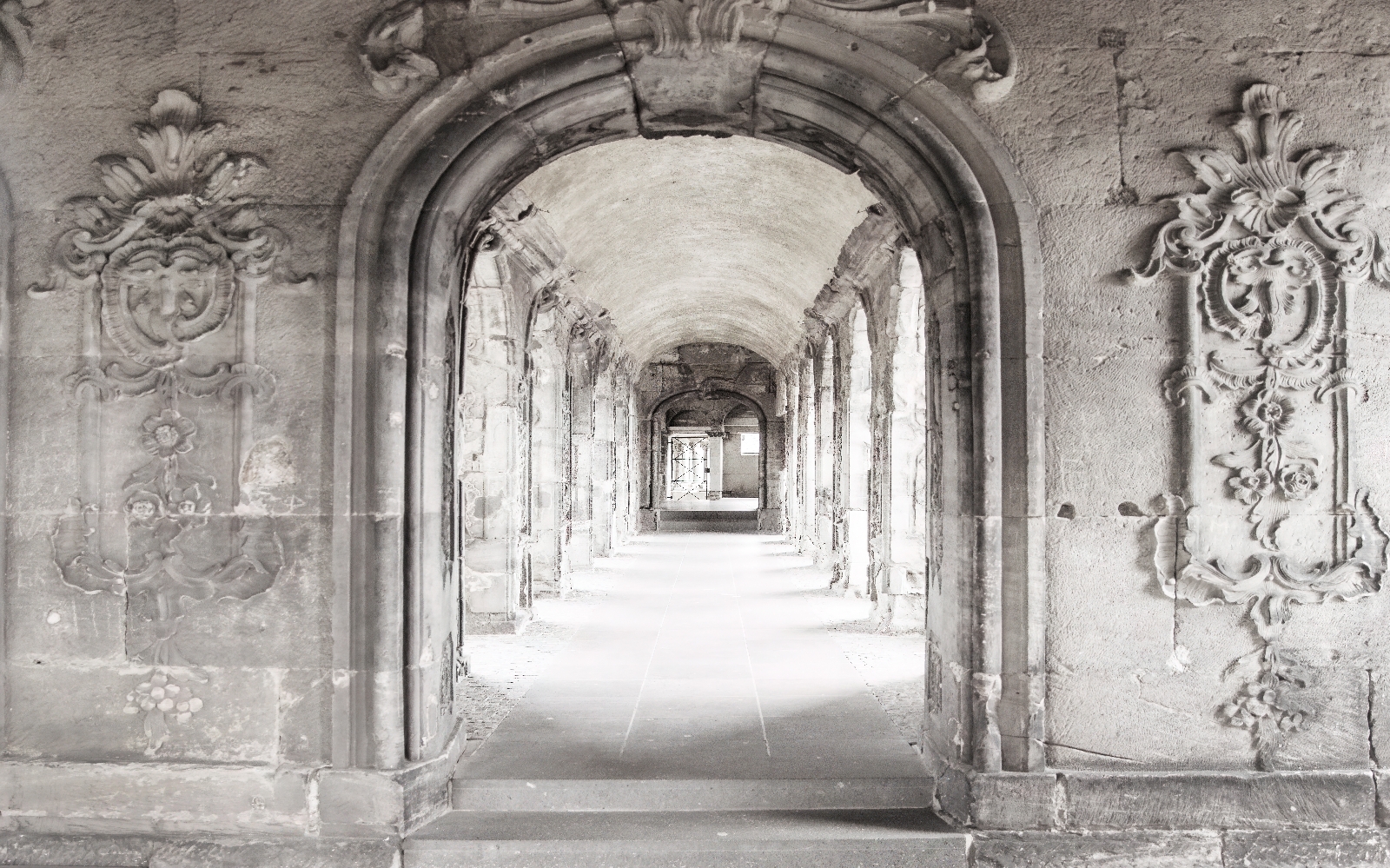 Stone archway with a stone wall