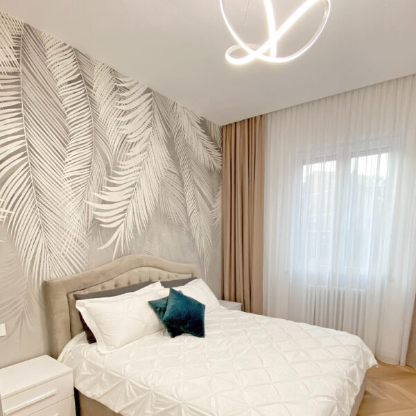 Bílé listy na šedém pozadí Bílé listy na šedém pozadí