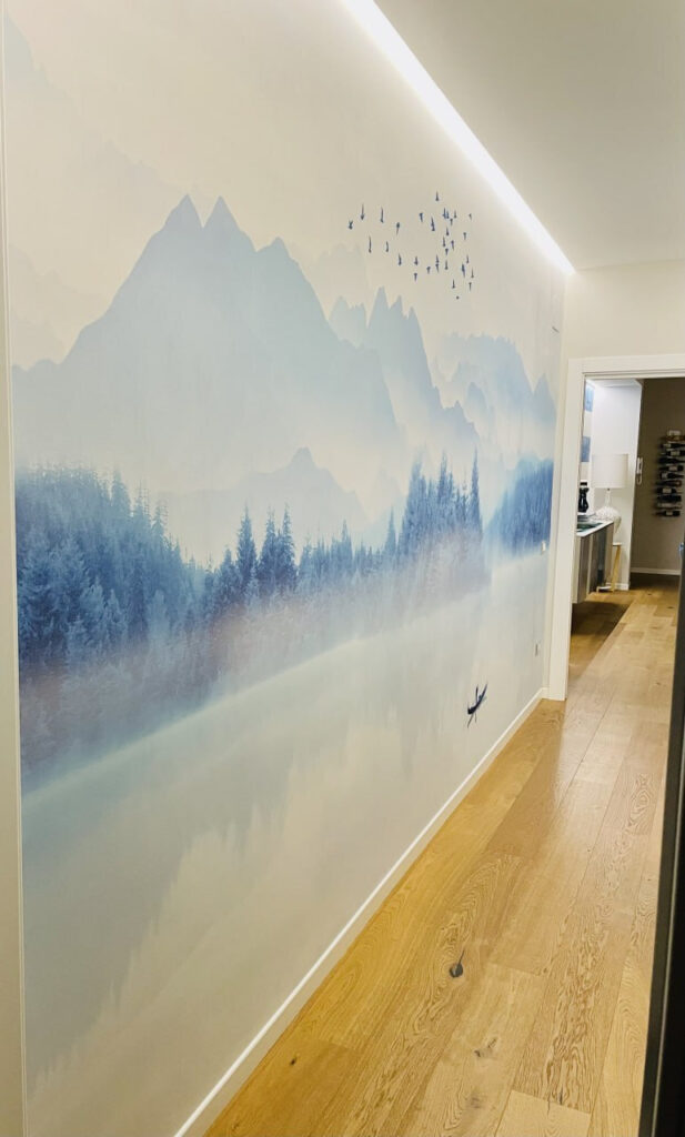 Person in a boat on a lake with birds flying in the sky Person in a boat on a lake with birds flying in the sky