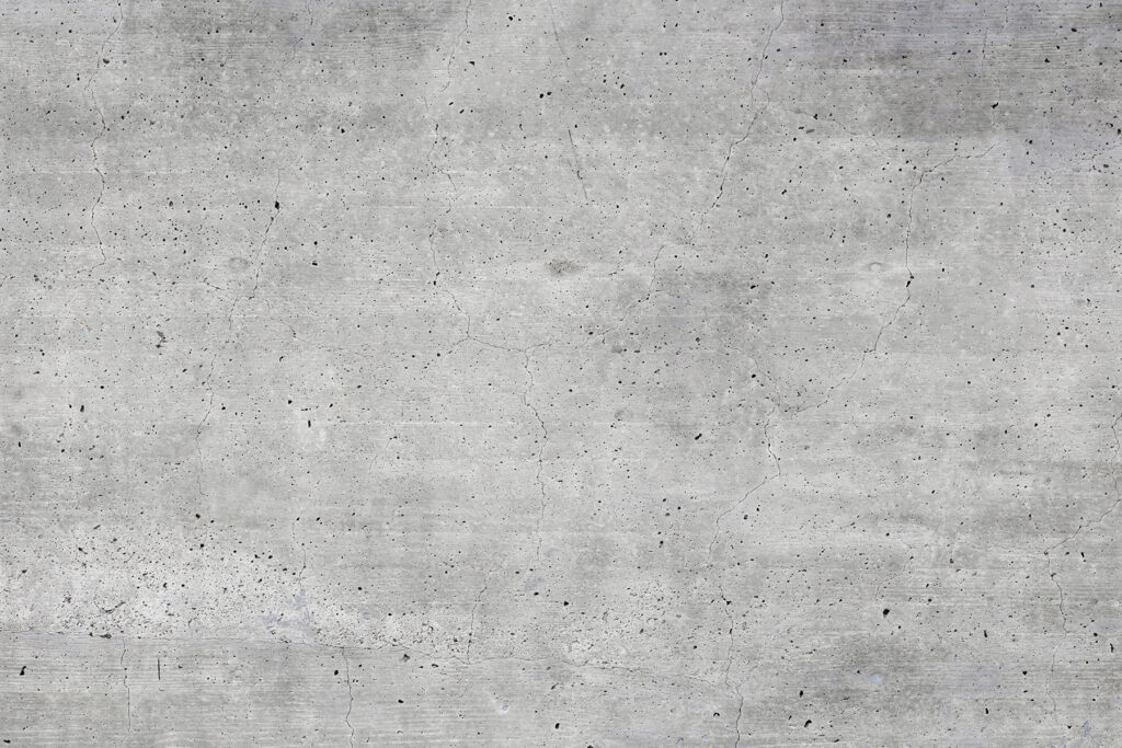 Grey concrete surface with small specks Grey concrete surface with small specks