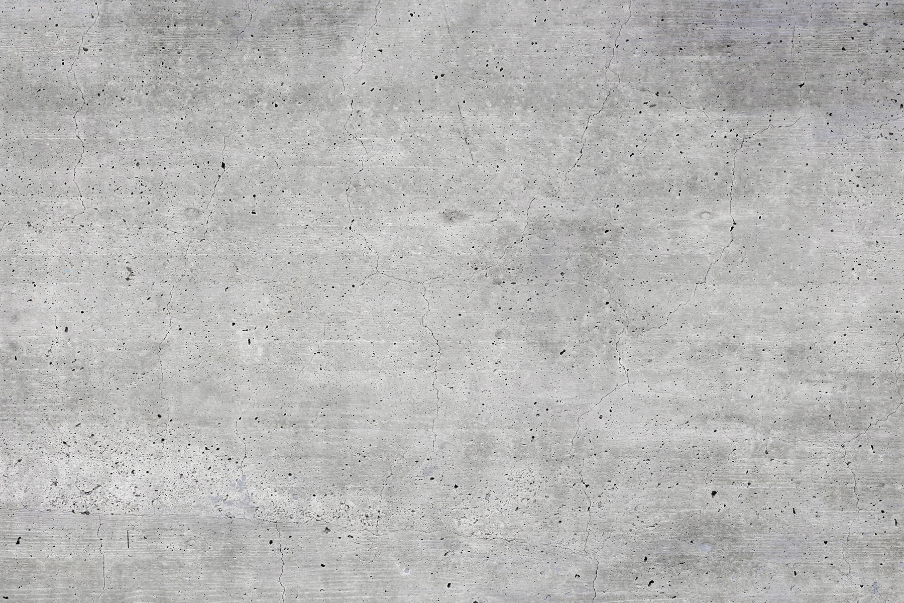 Grey concrete surface with small specks Grey concrete surface with small specks