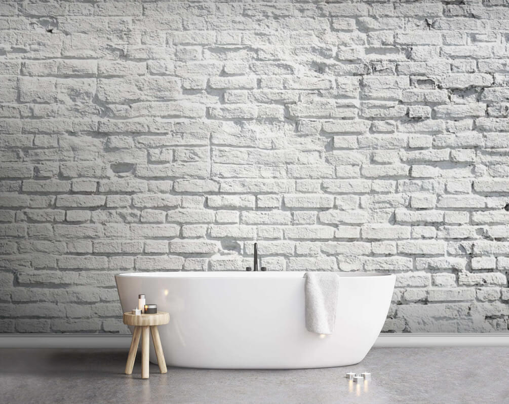 White brick wall with black spots