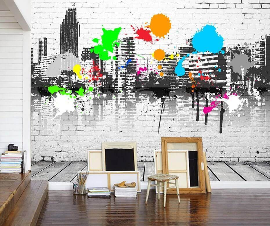White brick wall with colorful paint splatters White brick wall with colorful paint splatters