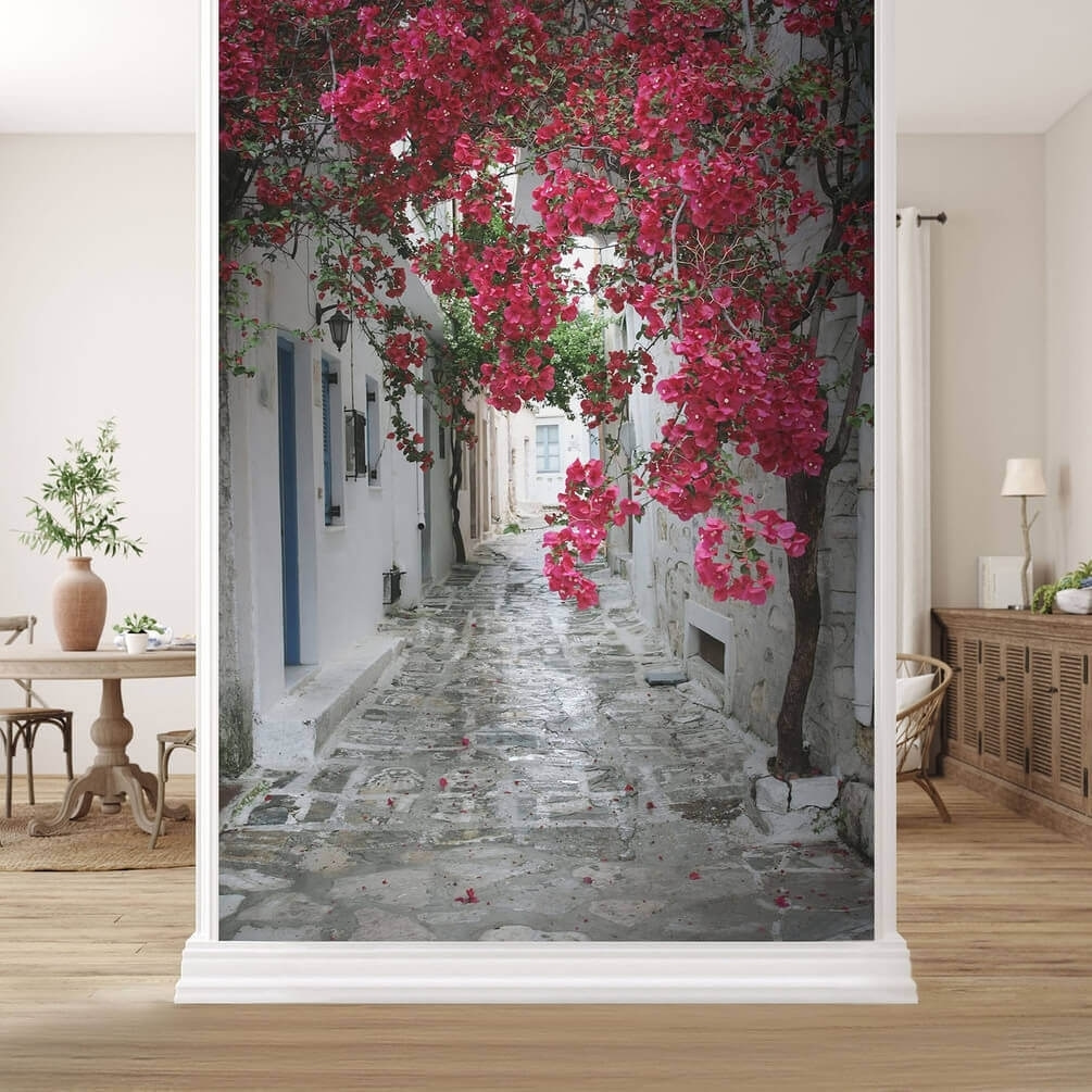 Stone alley with pink flowers