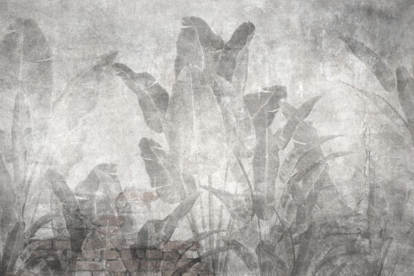 Grey wall with leaves and a brick wall