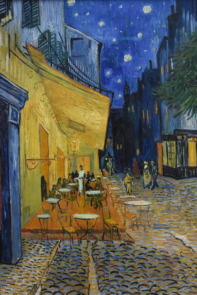 A painting of a street with tables and chairs