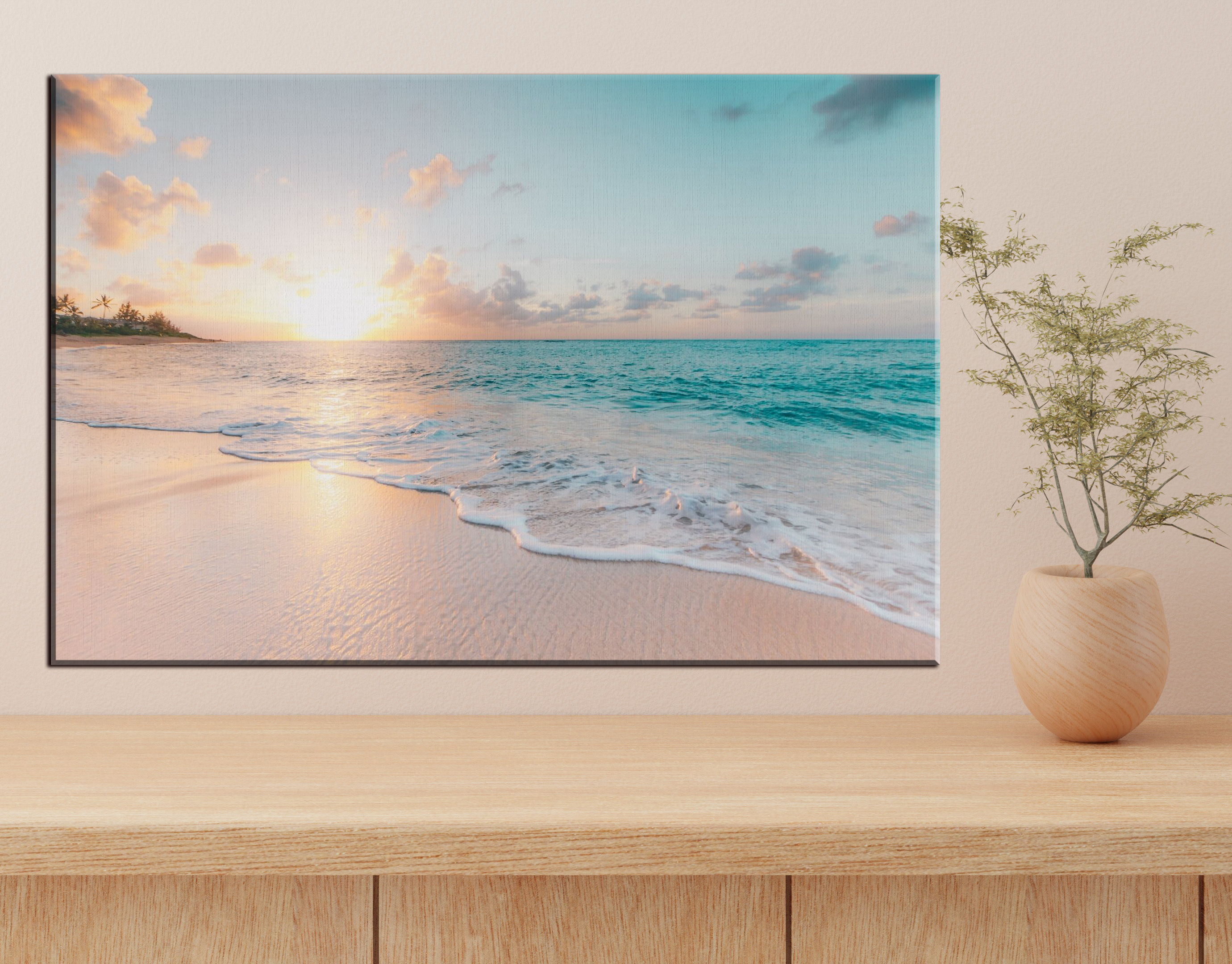 A beach with waves and a sunset