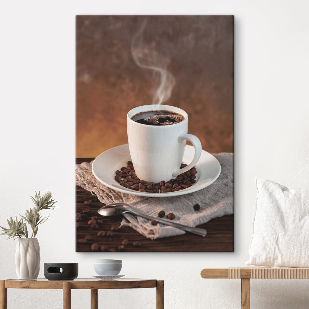 A cup of coffee on a plate with beans and a spoon A cup of coffee on a plate with beans and a spoon