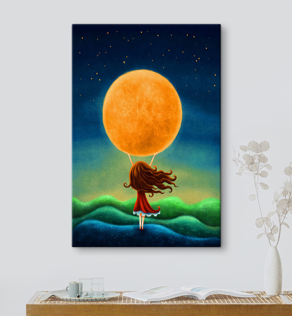 A girl holding a large yellow moon A girl holding a large yellow moon