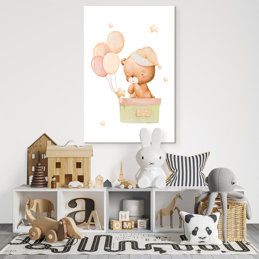 A teddy bear in a box with balloons A teddy bear in a box with balloons