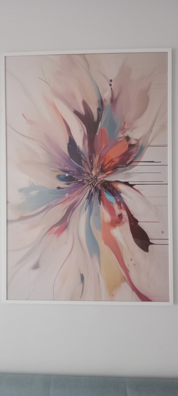 A colorful flower with a burst of paint