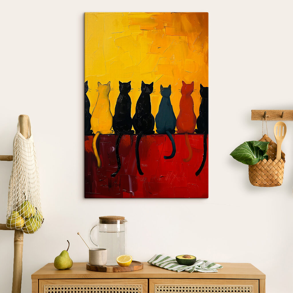 A group of cats sitting on a red surface