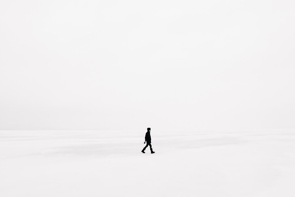 Person walking in the snow Person walking in the snow
