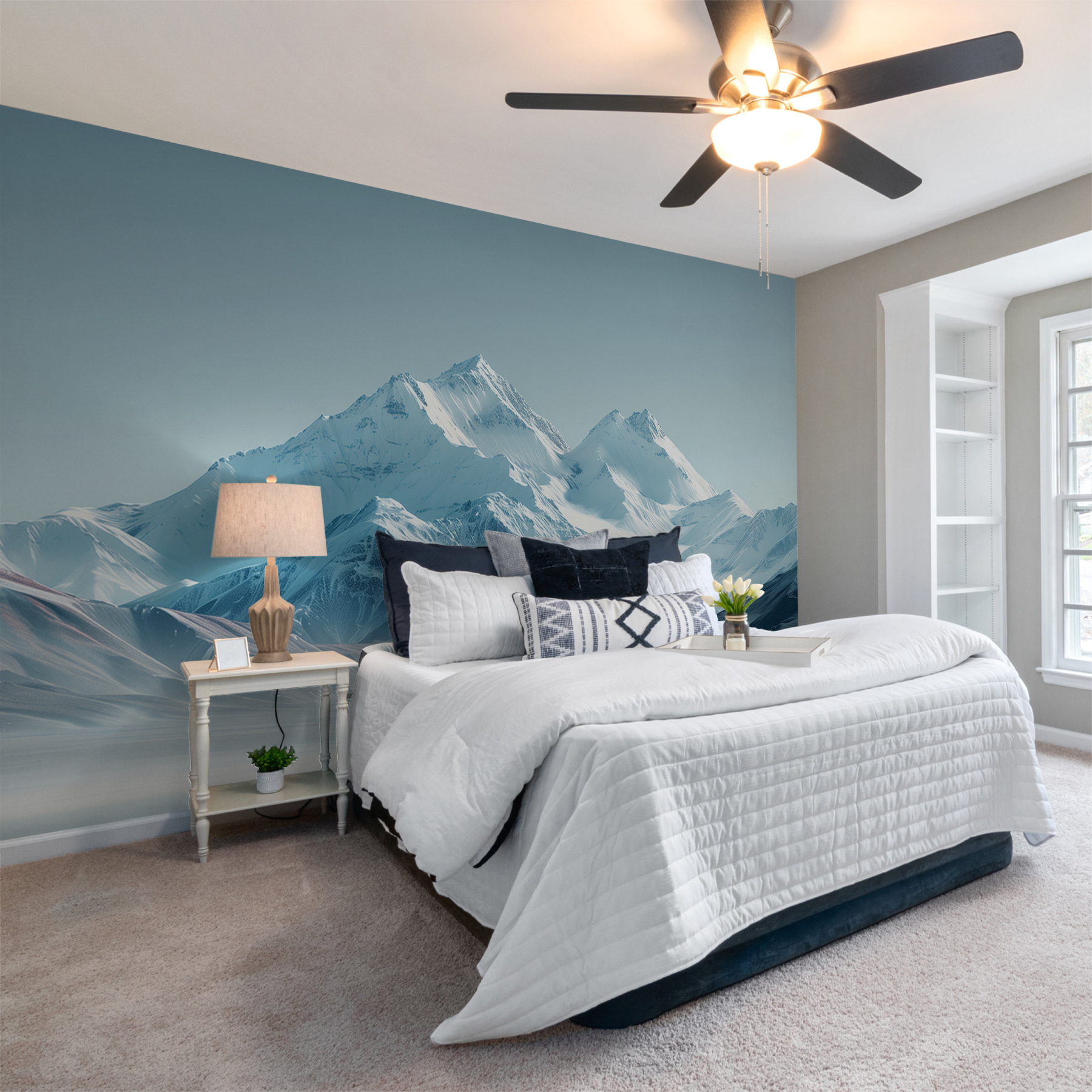 Snowy mountain range with a body of water