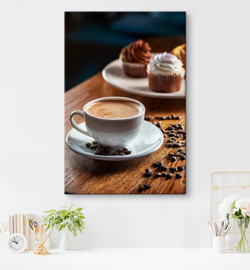 Cup of coffee and cupcakes on a table