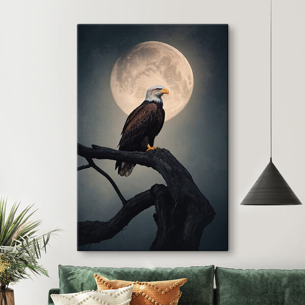 Bald eagle on a branch with a full moon in the background Bald eagle on a branch with a full moon in the background