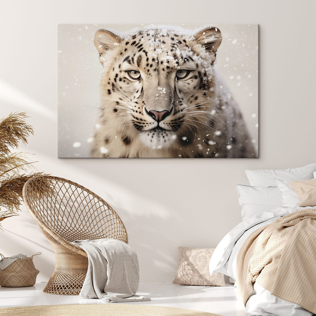 Snow leopard with snow on its head