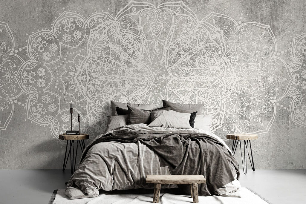 White ornate design on a grey surface