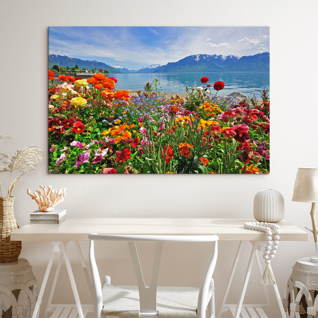 Flower bed with flowers and a lake in the background