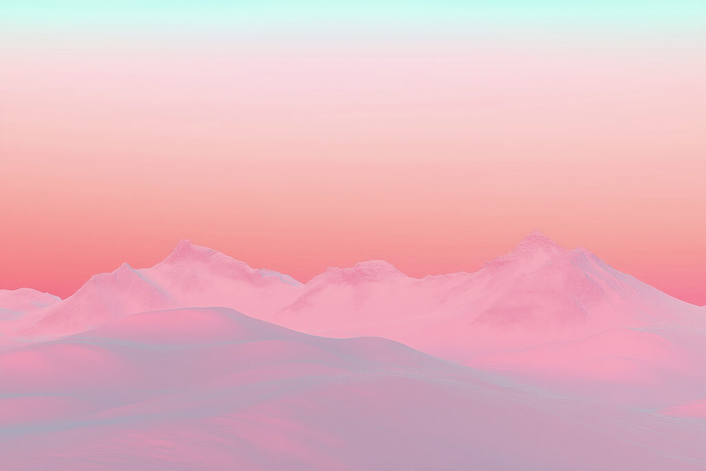 Pink and blue sky over a snowy mountain range