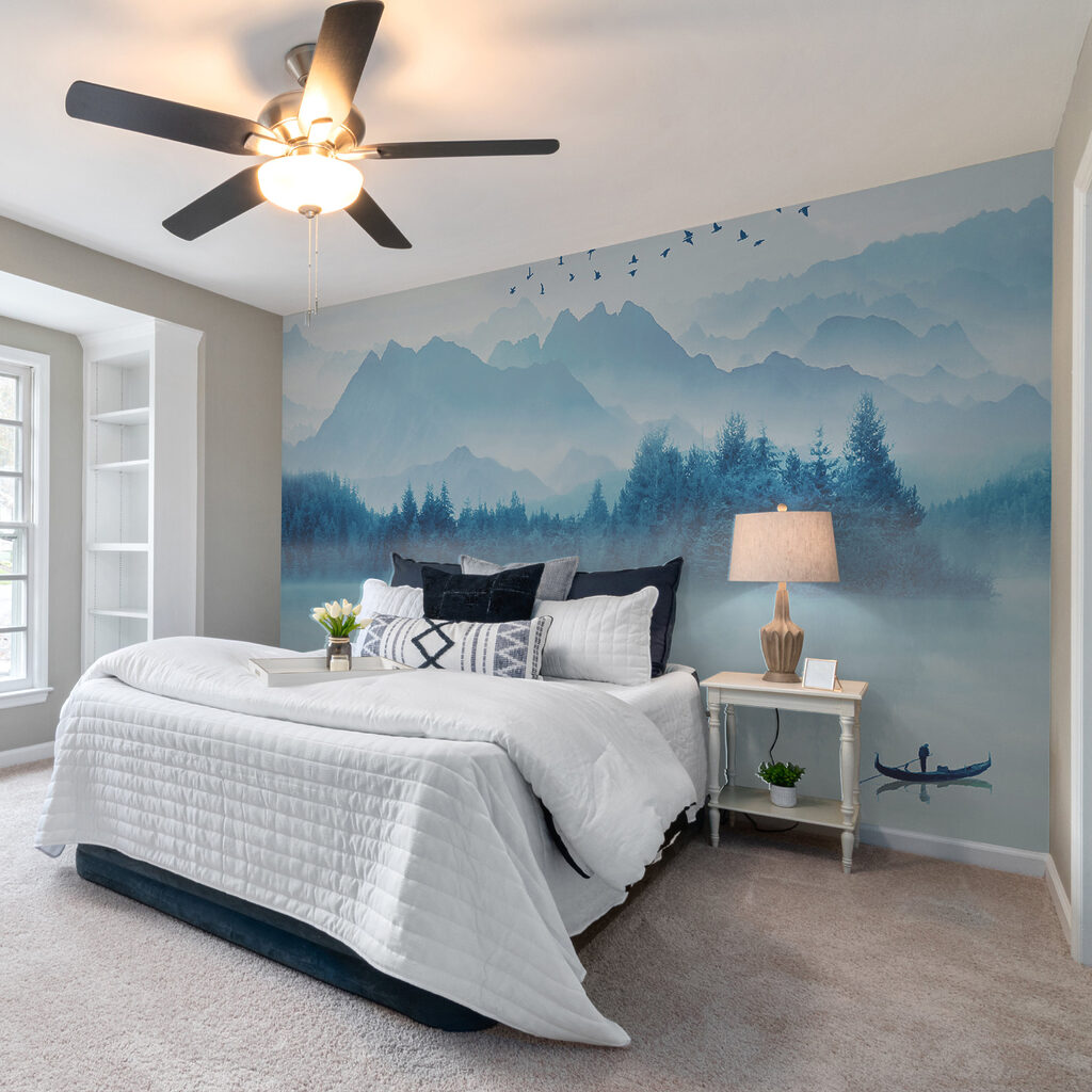 Person in a boat on a lake with birds flying in the sky Person in a boat on a lake with birds flying in the sky