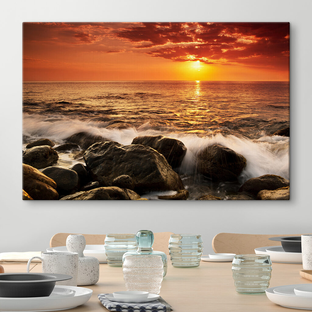 A sunset over a rocky beach A sunset over a rocky beach