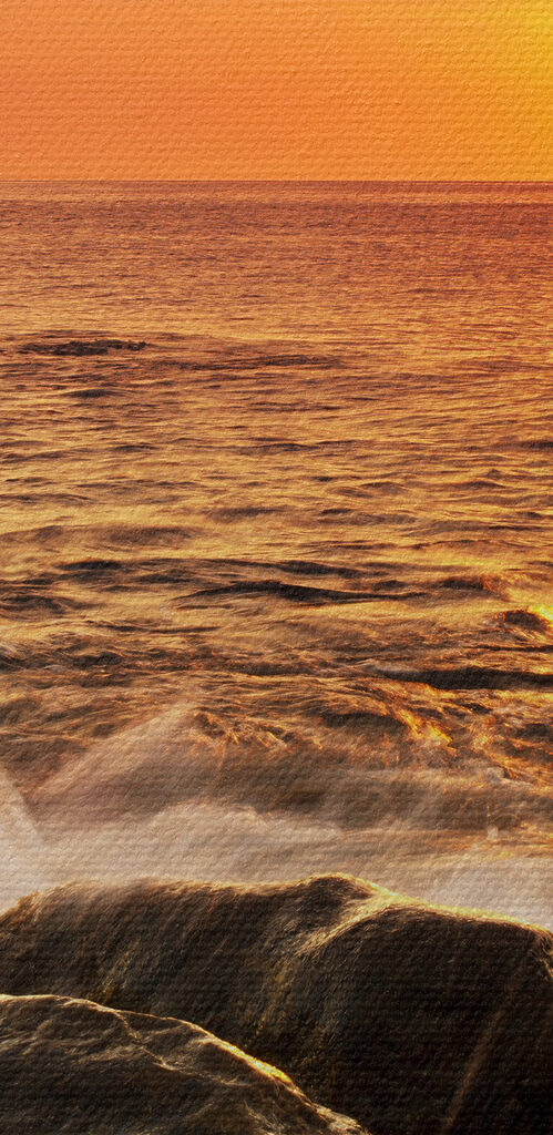 A sunset over a rocky beach A sunset over a rocky beach