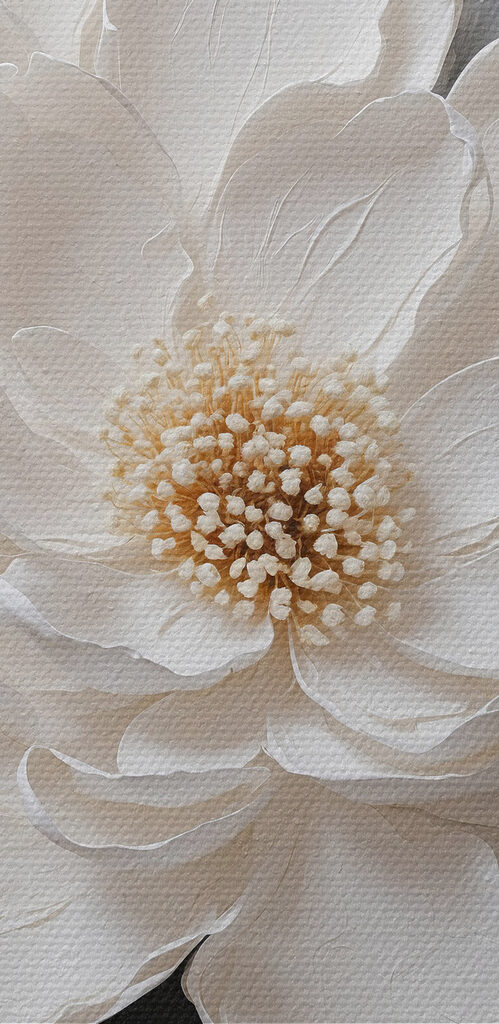 A white flower with black and grey leaves