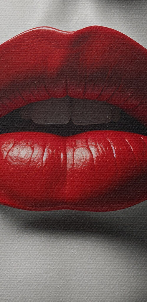 Red lips amidst abstract design