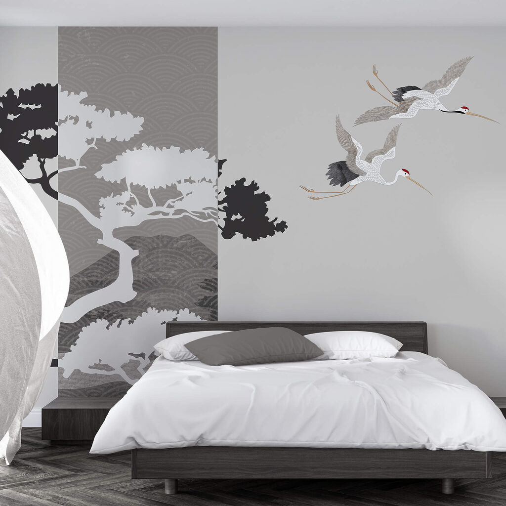 Pár jeřábů letících vedle stromu Pár jeřábů letících vedle stromu