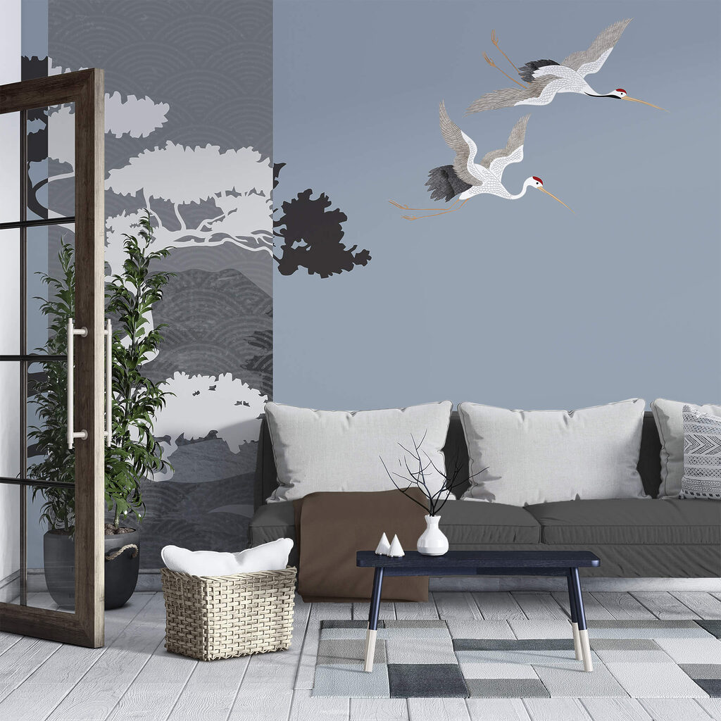 Pár jeřábů letících vedle stromu Pár jeřábů letících vedle stromu