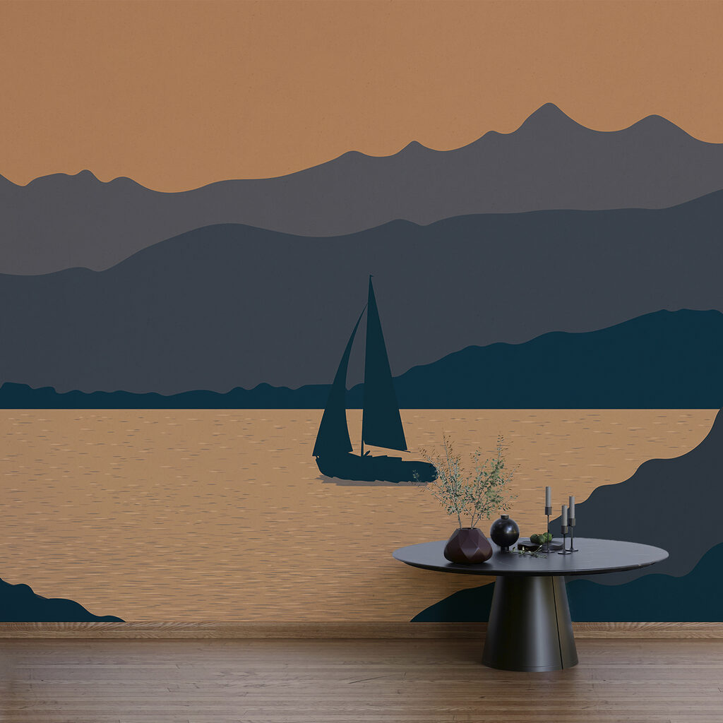 Plachetnice na vodě s horami v pozadí