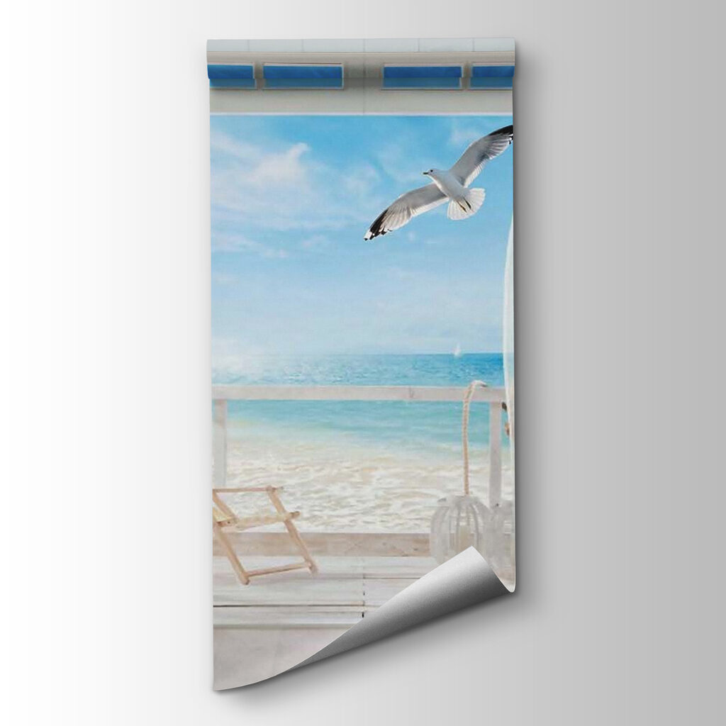 View of a beach from a room with a bird flying over it