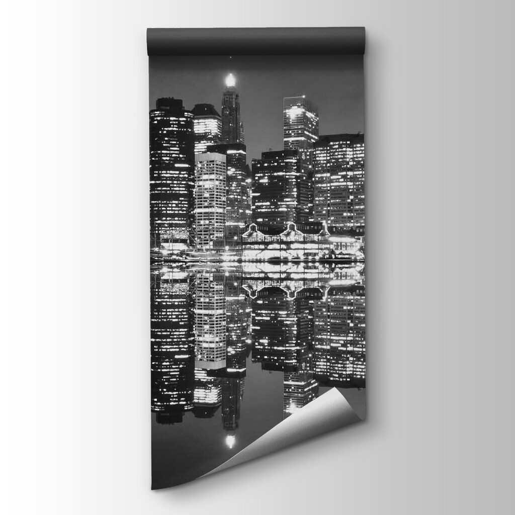 City skyline at night with lights reflecting on water City skyline at night with lights reflecting on water