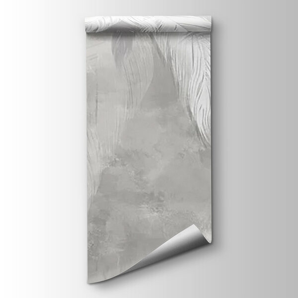 White feather on a grey surface White feather on a grey surface