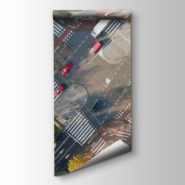 Aerial view of a street intersection with cars and buildings