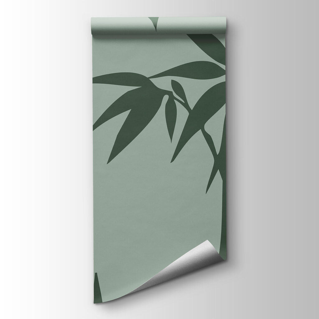 Green bamboo leaves on a grey background