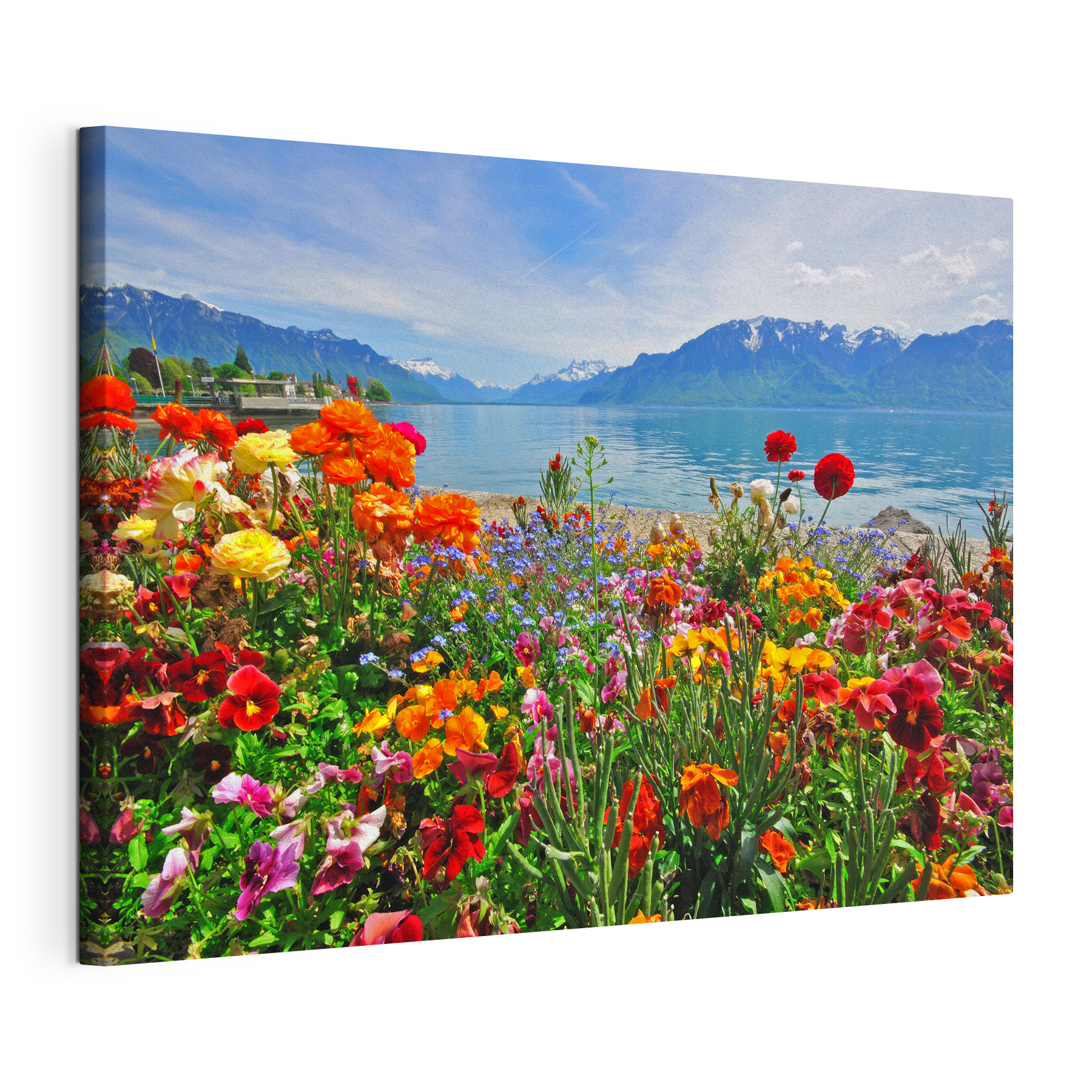 Flower bed with flowers and a lake in the background