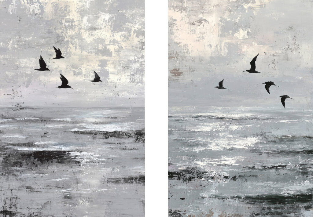 Group of birds flying over water