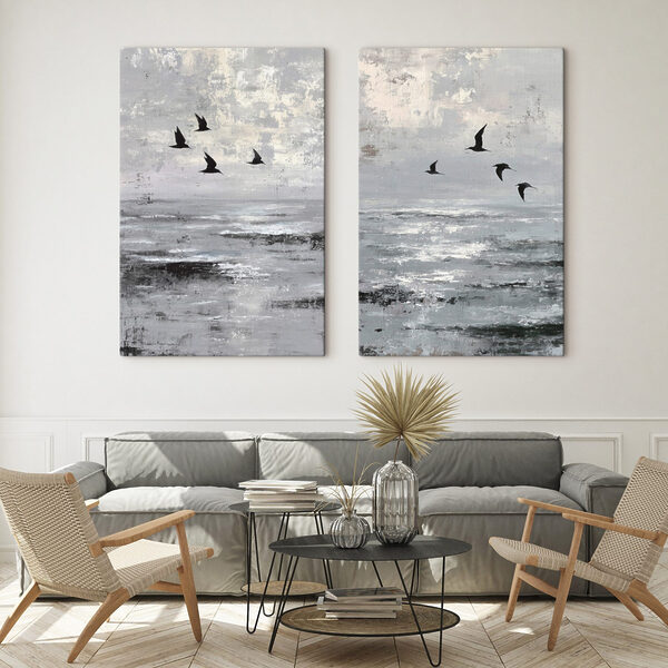 Group of birds flying over water